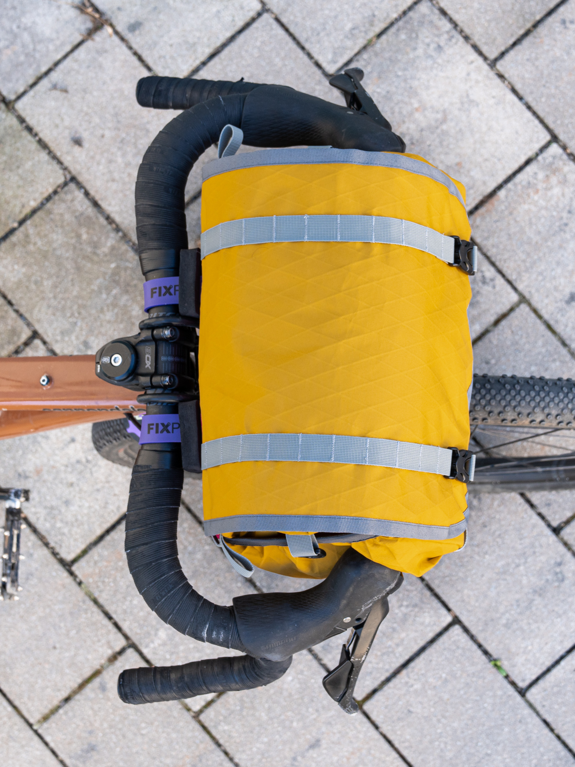 Small handlebar bag made from recycled X-Pac® RX30 in gold